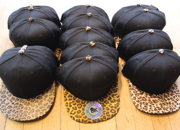 Wholesale lot of 15 Various Black/ Cheetah Snapbacks